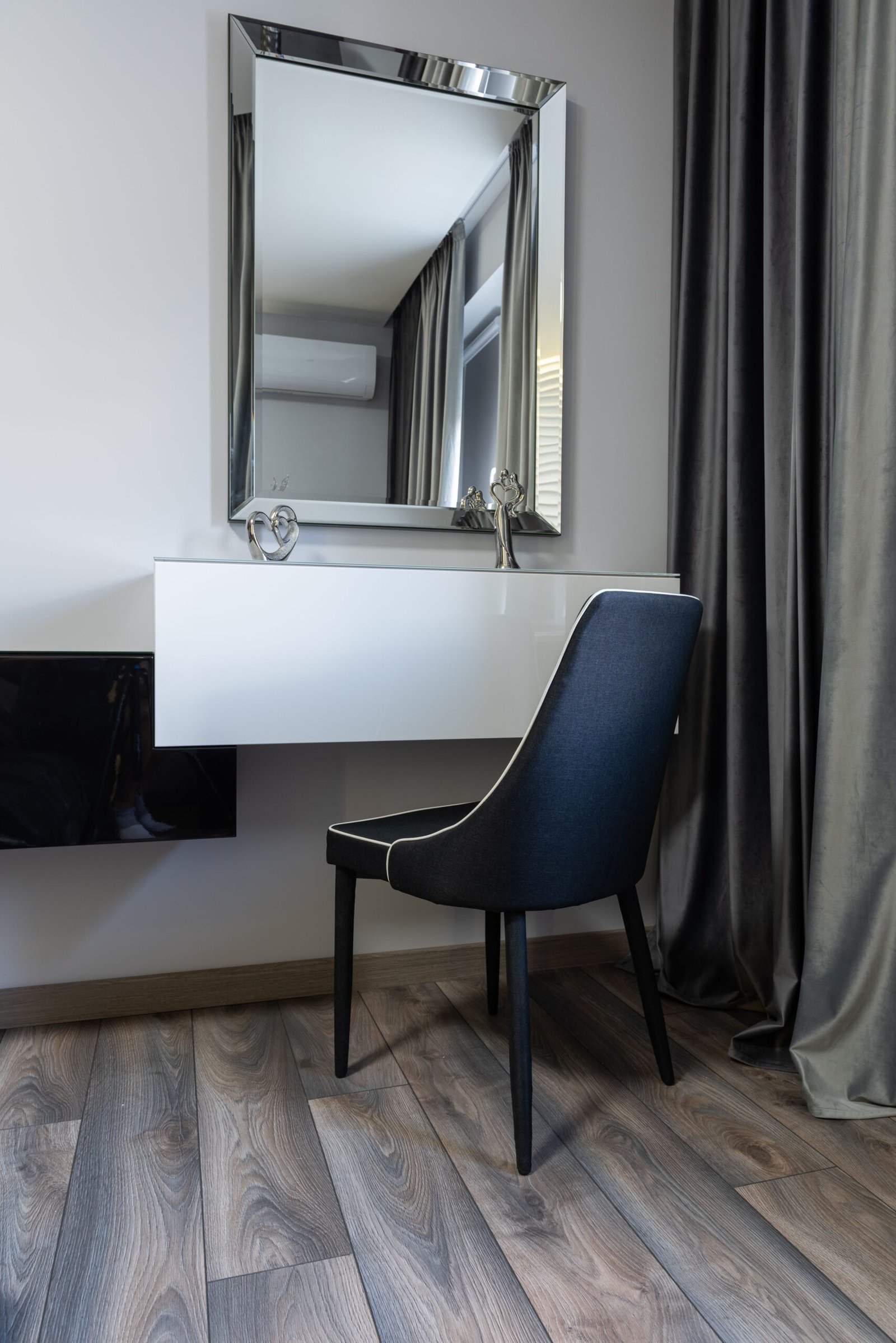 Minimalist modern style dressing table with a square mirror against white walls